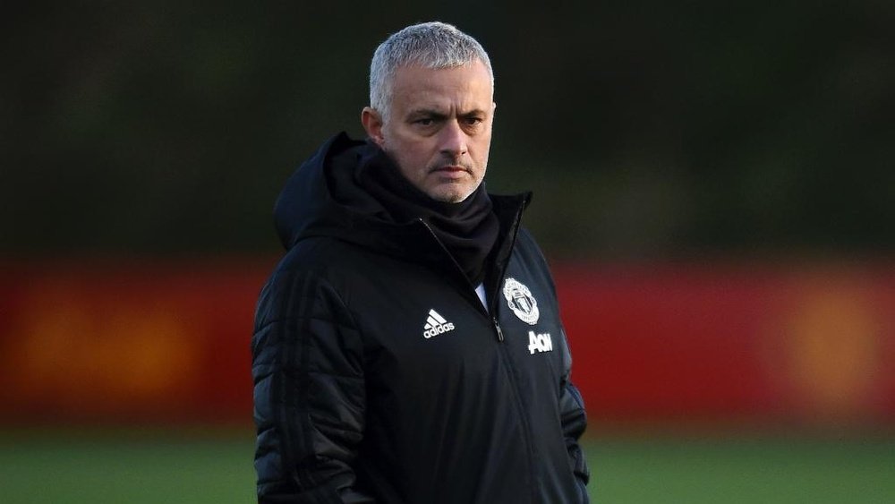 Jose Mourinho watches on as his Manchester United players train. GOAL