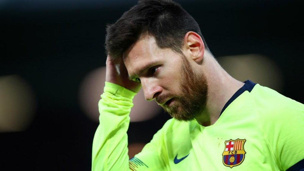 Lionel Messi cut a dejected figure at Anfield last night. GOAL