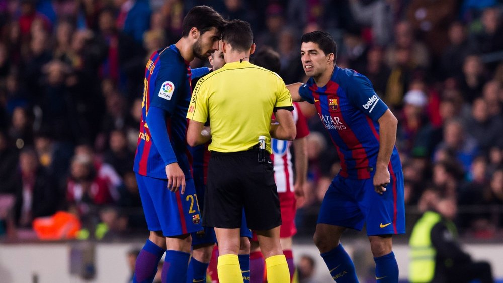 Luis Suarez protesting his second yellow in Tuesday's match. Goal