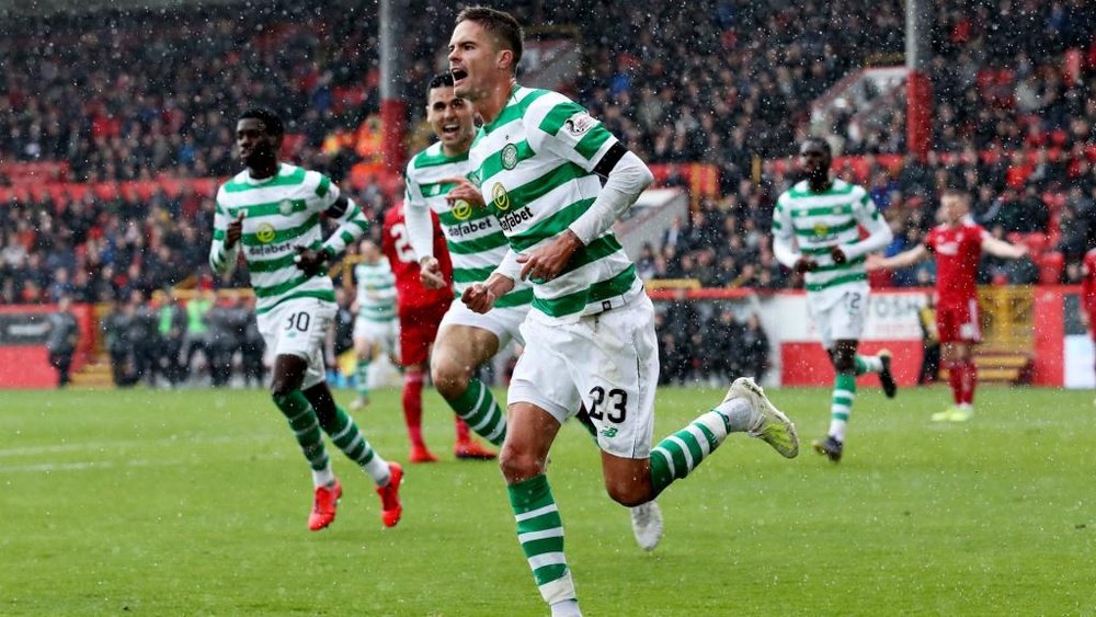 Mikael Lustig sent Celtic on their way to the league title at Aberdeen. GOAL