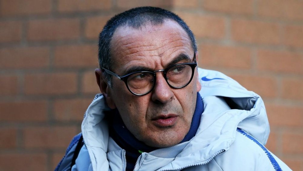 Sarri remains unsure whether Chelsea are serious contenders for the Premier League title . GOAL