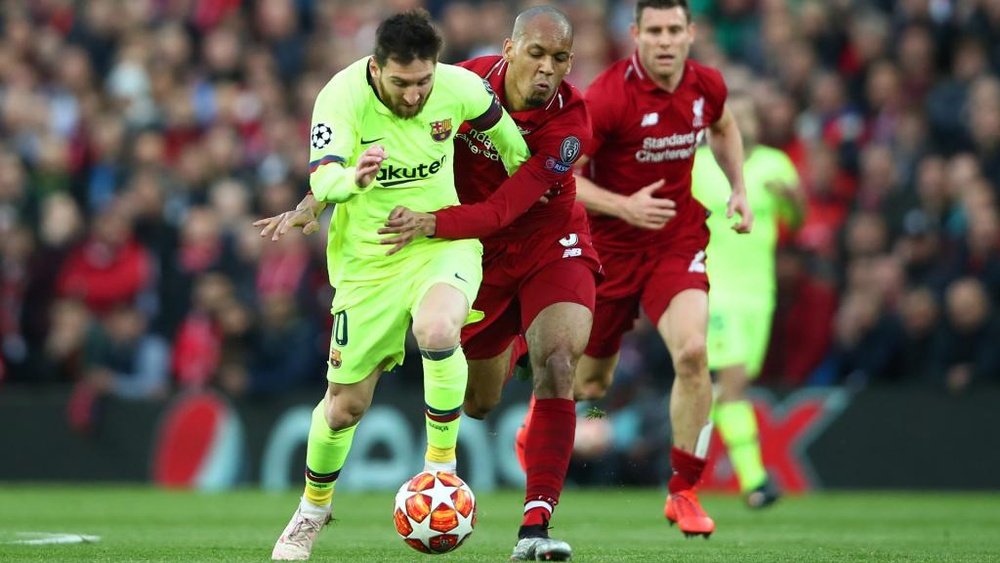 Fabinho attempting to stop Lionel Messi. GOAL