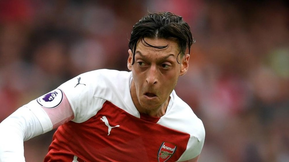 Ozil has had a tough summer. GOAL