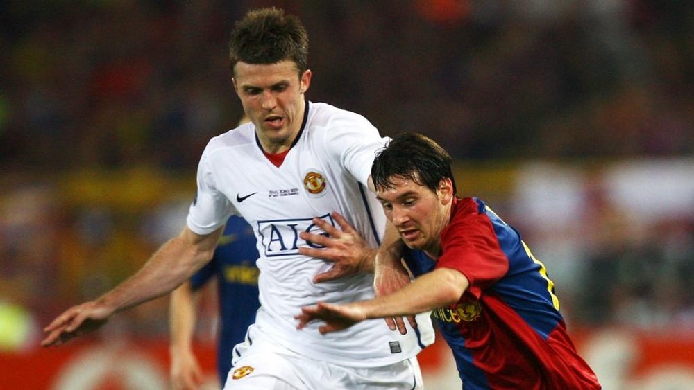 Michael Carrick battles for possession with Lionel Messi. GOAL