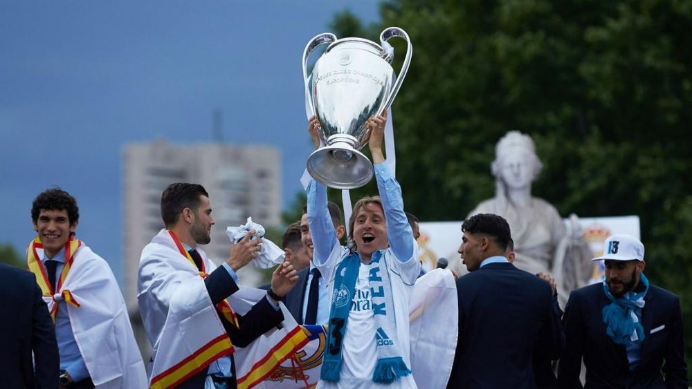 Modric celebrates lifting the Champions League. GOAL