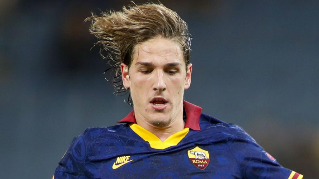 Nicolo' Zaniolo of AS Roma looks dejected receiving a red card