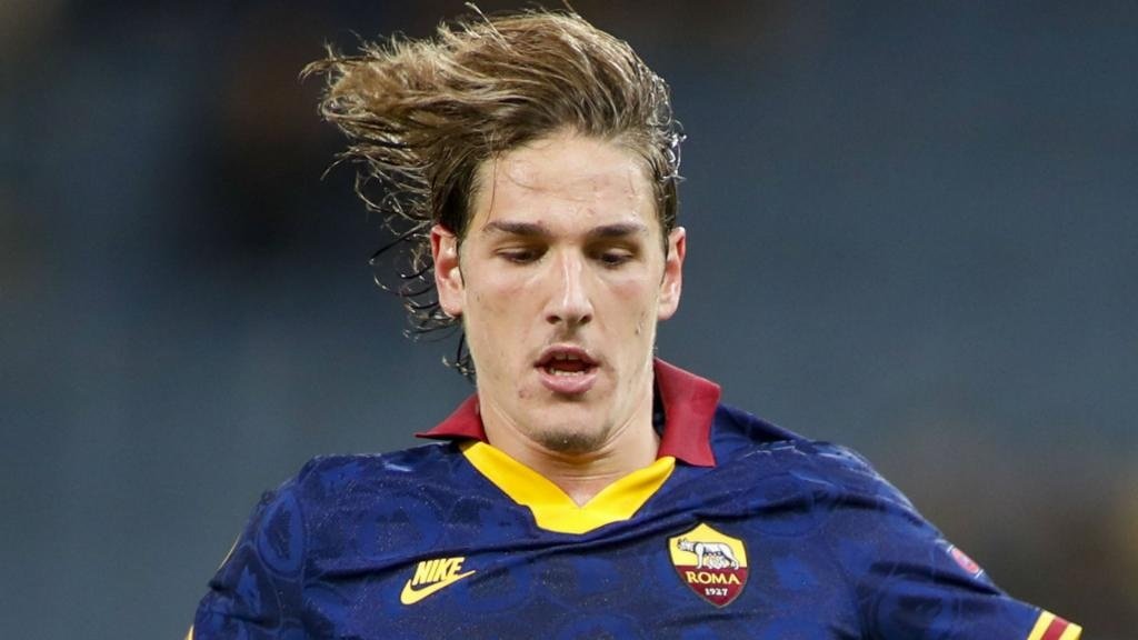 Nicolo Zaniolo was taken off on a cart in the first half of Roma's loss to Juve. GOAL