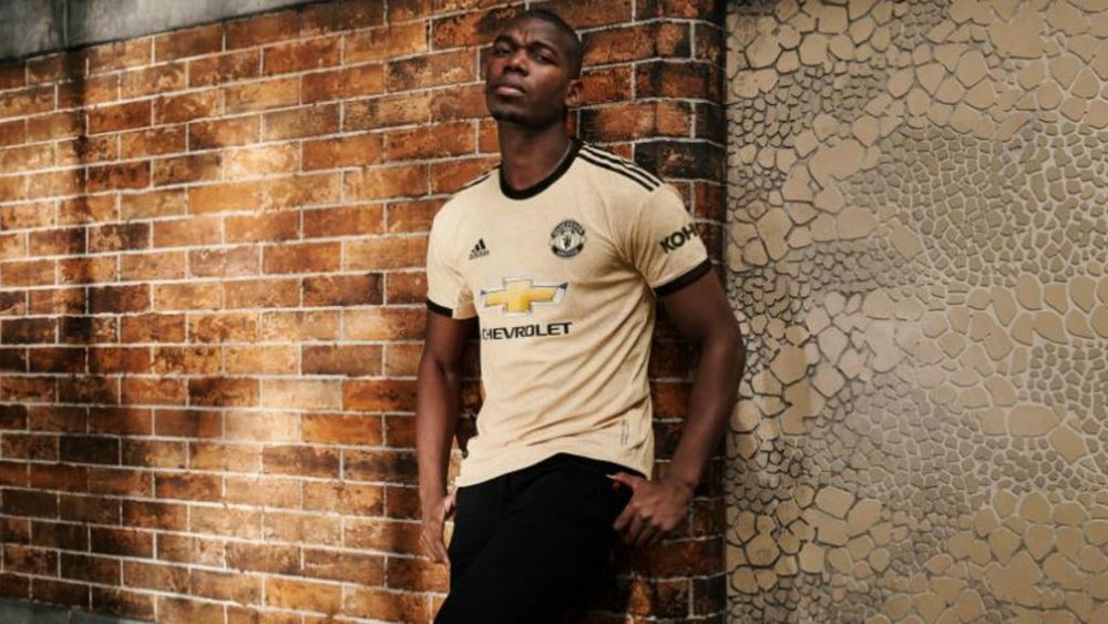 Pogba models the new United away kit despite wanting to leave club. GOAL