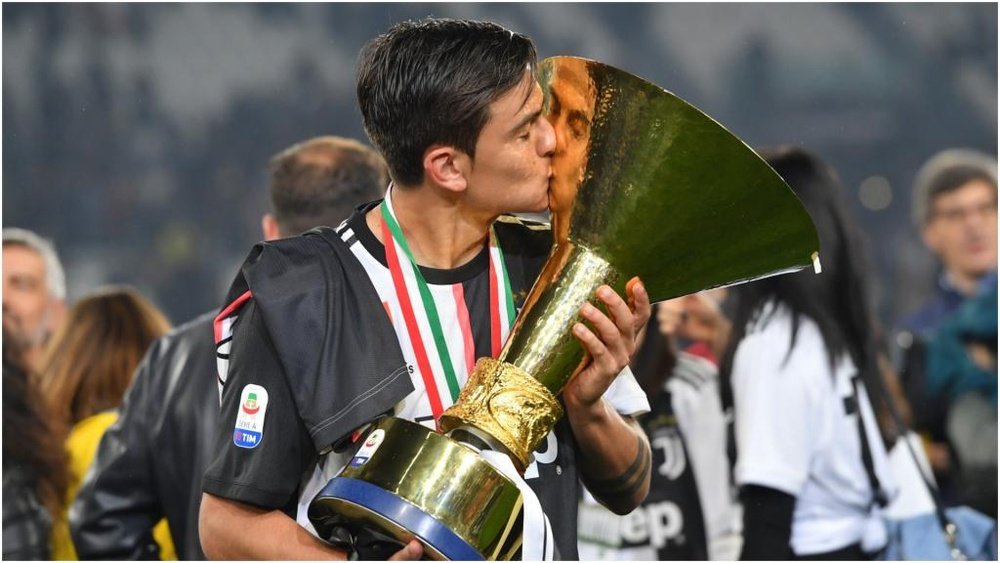 Paulo Dybala with the Serie A trophy. GOAL