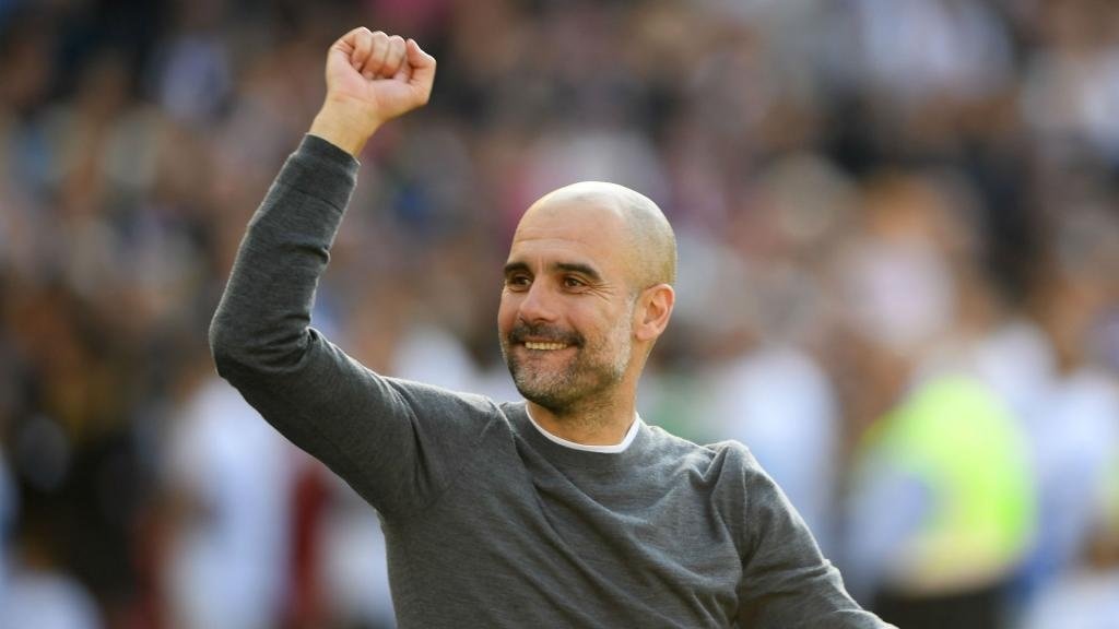 Guardiola challenges champions City to make history with treble