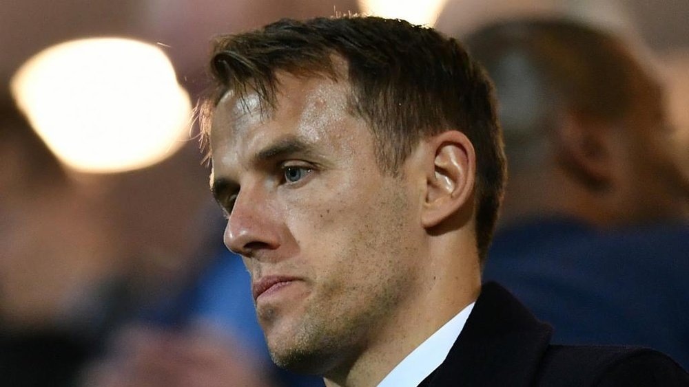 Neville will not face disciplinary action after apologising for controversial Twitter posts. GOAL