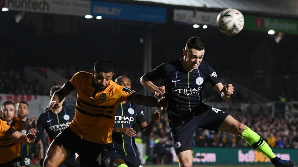 Foden battled through the playing conditions to net two for City. GOAL