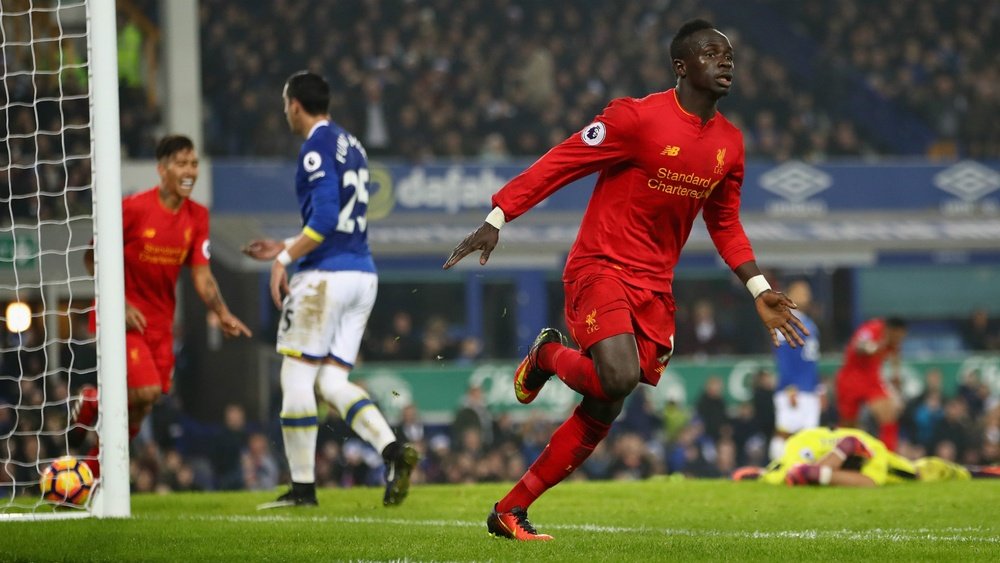 Sadio Mane celebrates his late winner in the Merseyside derby. Goal