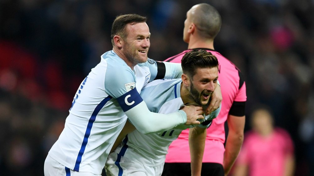 Adam Lallana (right) with Wayne Rooney. Goal