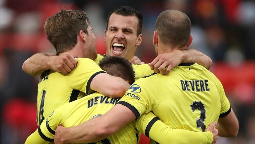 Phoenix prevail after controversial penalty as Sydney FC go top of A-League. AFP